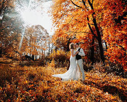 Fall wedding ceremony with colorful leaves