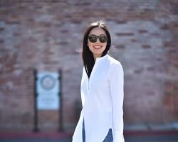 Image of classic white shirt, jeans, and blazer